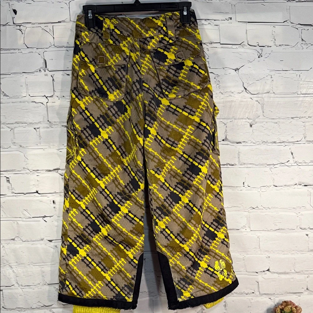 SPYDER Boys' Propulsion ski pants with an olive, black, and yellow plaid pattern